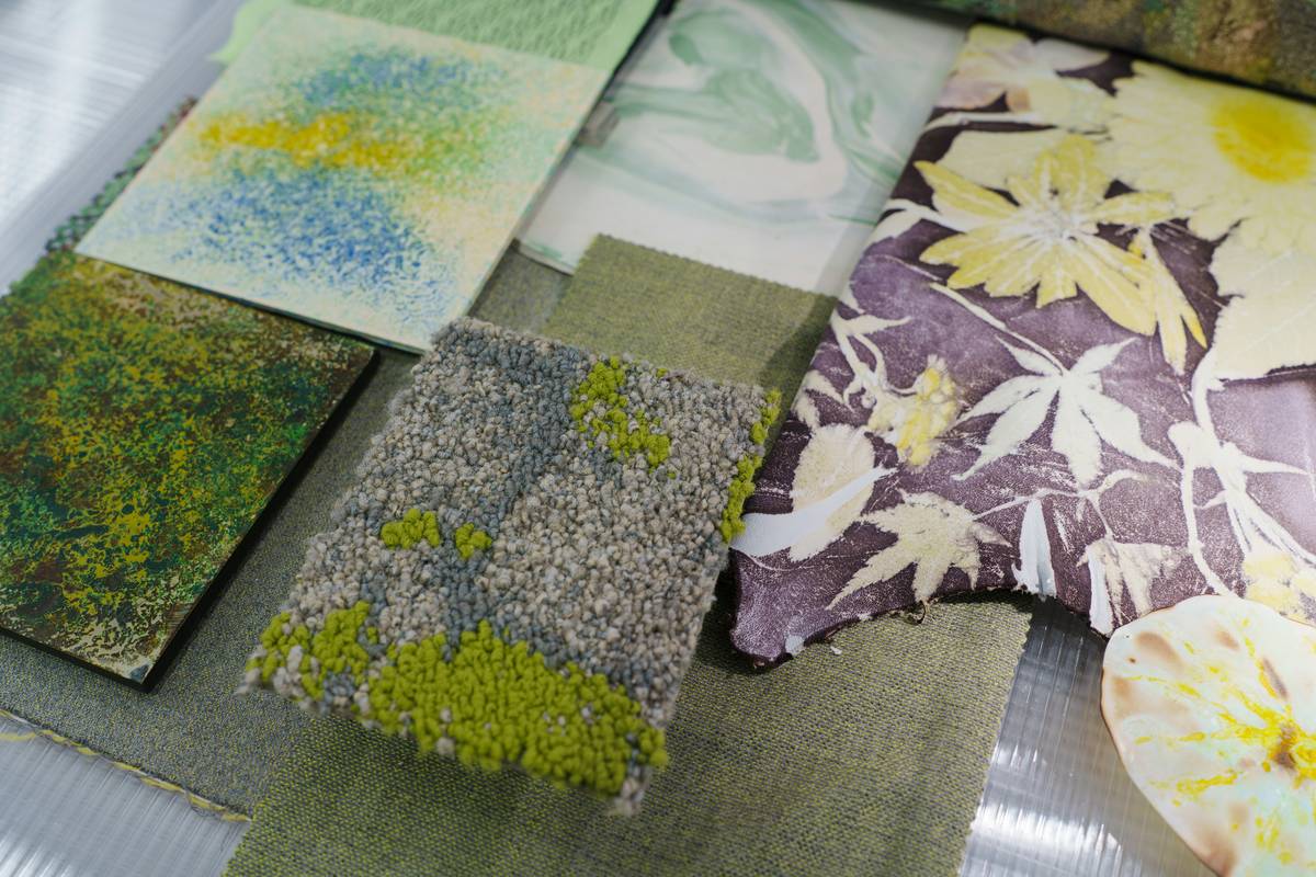 Close-up of custom fabric printing for fur hats showing crisp floral motif on black fox fur with visible stitch-free edge binding